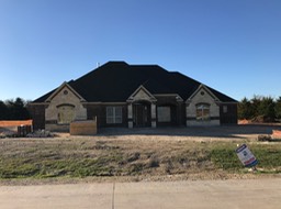 Front of Home with Sheetorck Debris