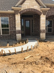 Sidewalk to Front Entry  Gutter is being moved back