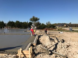 Worker Smooting Concrete