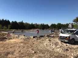 Workers Pulling Form Boards at Garage